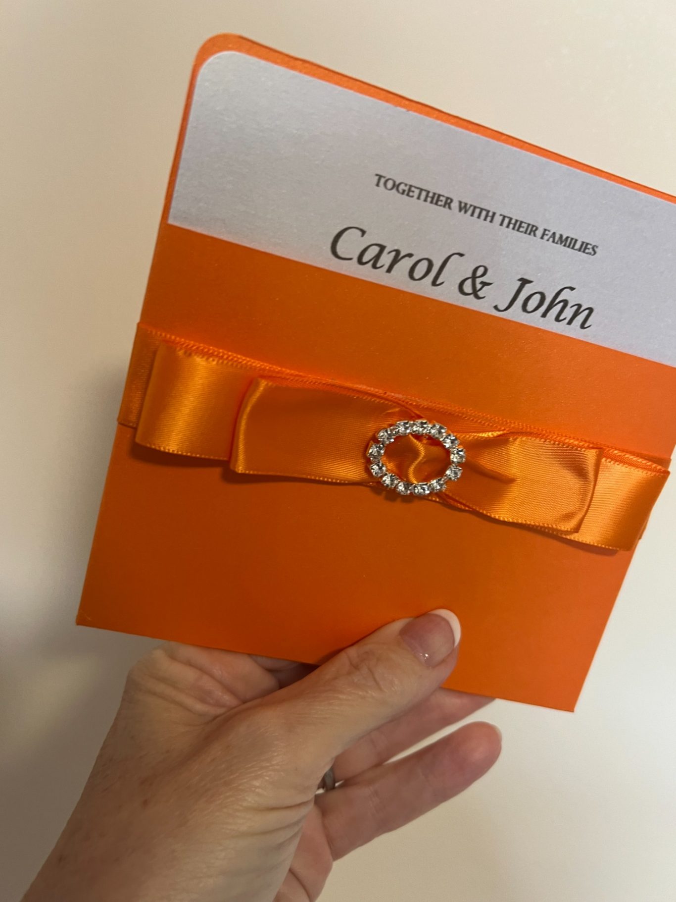 Orange daiquiri pocket with orange satin ribbon and white insert