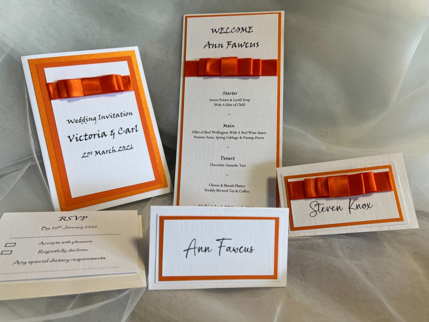 On white linen with orange trims